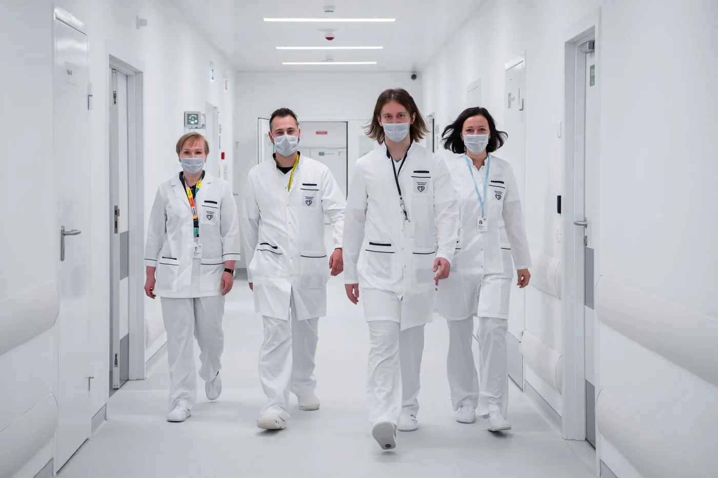 Healthcare professionals walking together down a hospital corridor