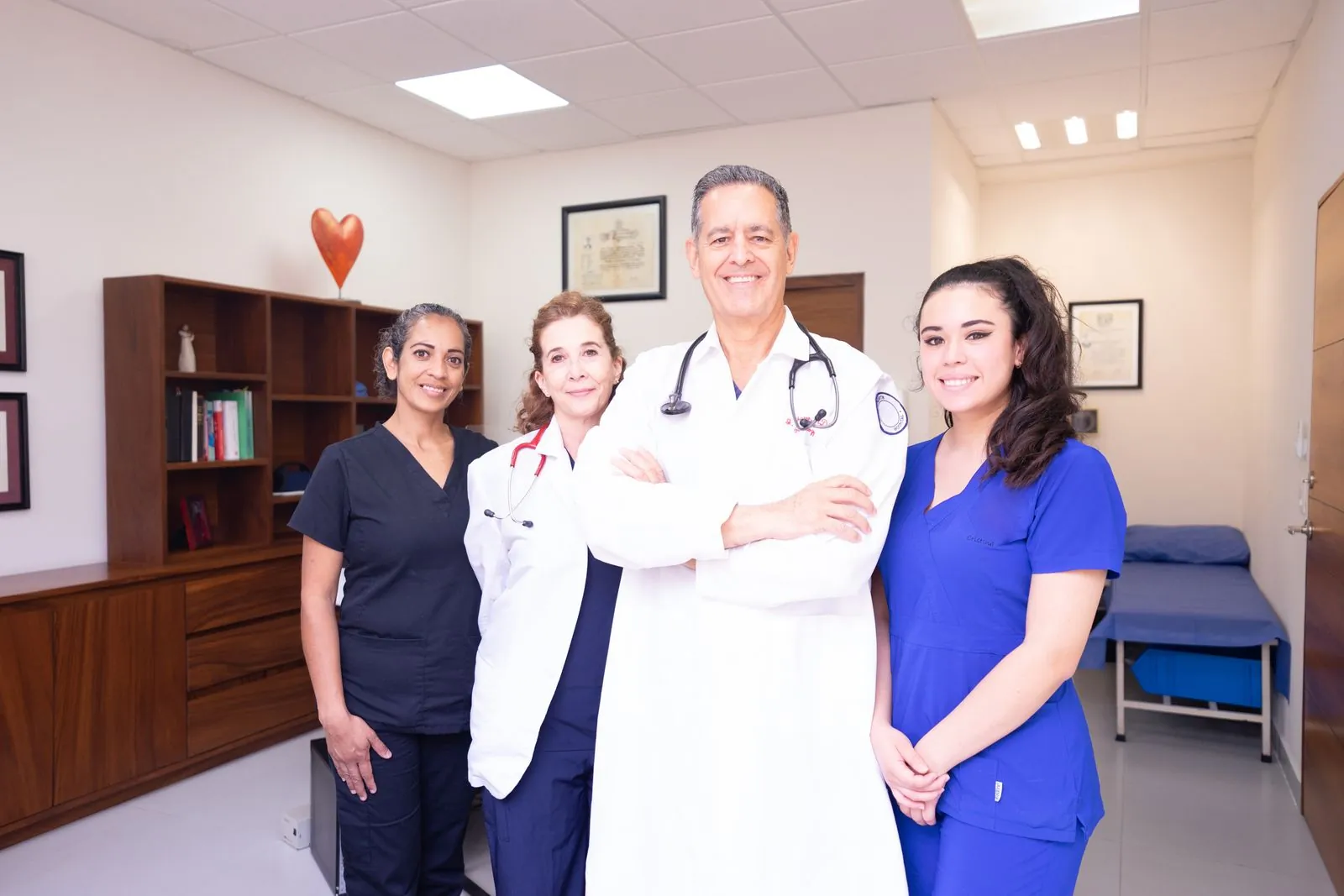 A doctor and nurses standing together as one team